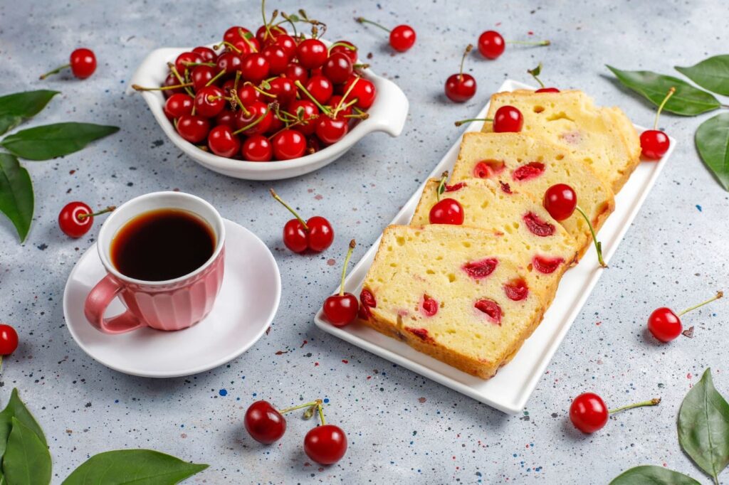 Delicious cherry cake with fresh cherries and tea